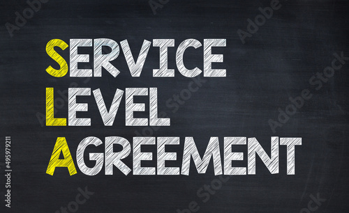 Service level agreement - SLA acronym written on chalkboard, business acronyms.