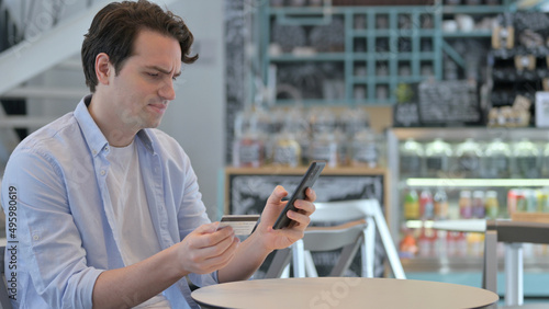 Creative Man with Unsuccessful Online Payment on Smartphone