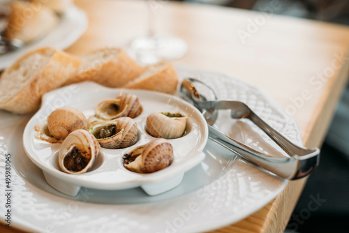 french snail dish with a glass of wine