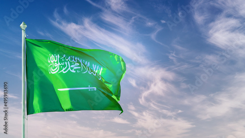 Billede på lærred Saudi Arabia flag on flagpole against blue sky