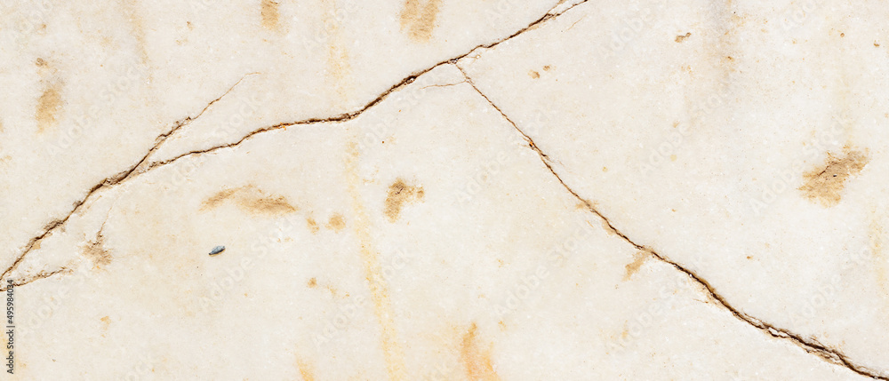 Obraz premium Cracked antique marble texture. Weather-cracked stone wall