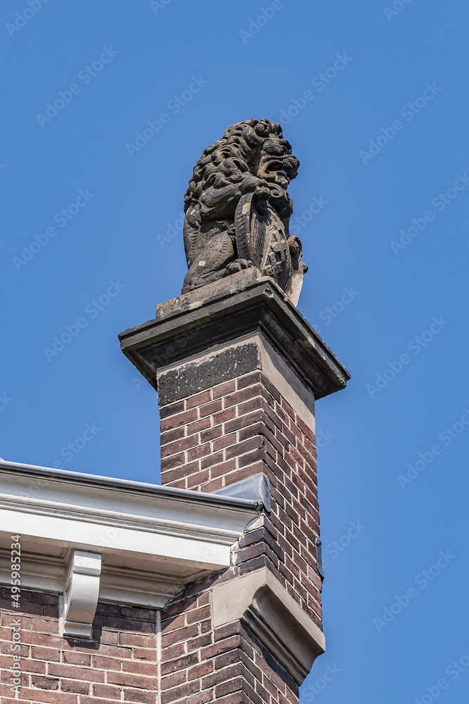 Architectural fragments of old Amsterdam building: XIX century Neo-Renaissance-style building, former Town Hall and Archive of Amstel Community (now 5-star hotel). Amsterdam, The Netherlands.