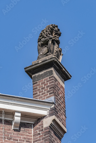 Architectural fragments of old Amsterdam building: XIX century Neo-Renaissance-style building, former Town Hall and Archive of Amstel Community (now 5-star hotel). Amsterdam, The Netherlands.