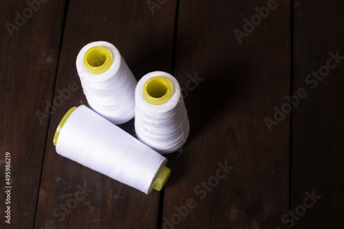  white sewing threads on the table