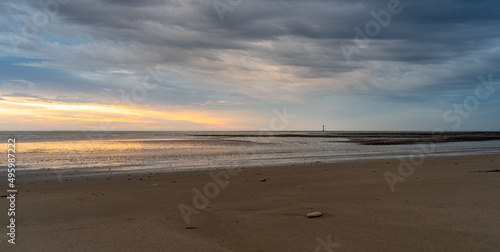 Chauveau Lighthouse standing in atlantic ocean stunning sunset sunrise reflection reflected in water and sea. © mathilde