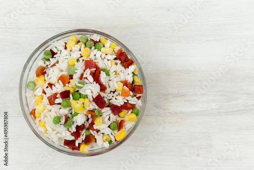 Frozen mixture of rice and vegetables, food background, close-up
