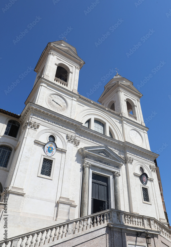 Trinita dei Monti church in Rome viewed from below with no people and sky in the background