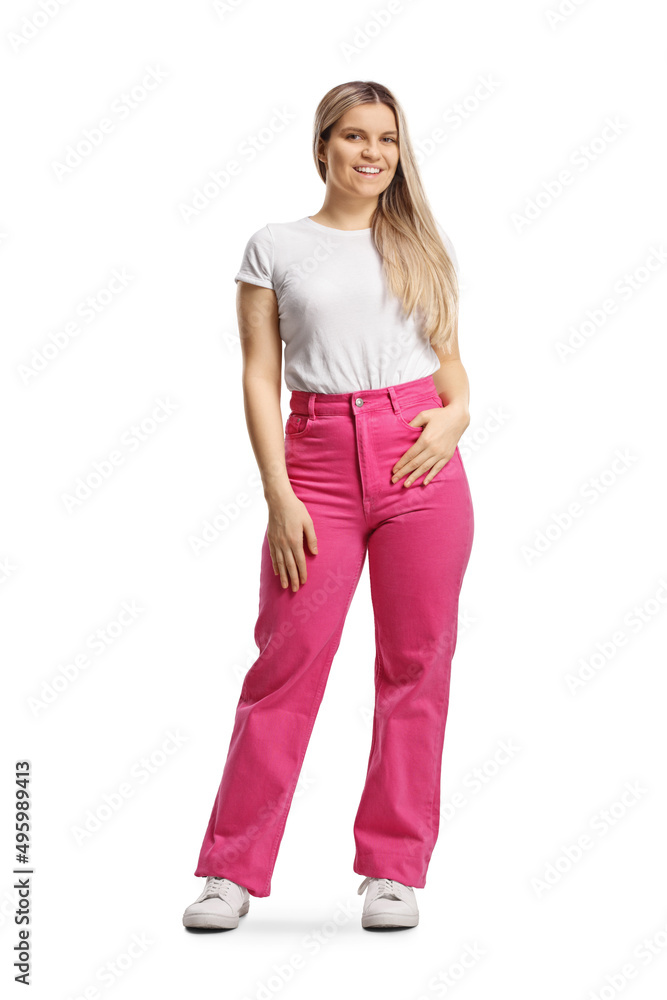 Full length portrait of a young woman in pink jeans posing Full length portrait of a young woman in pink jeans posing