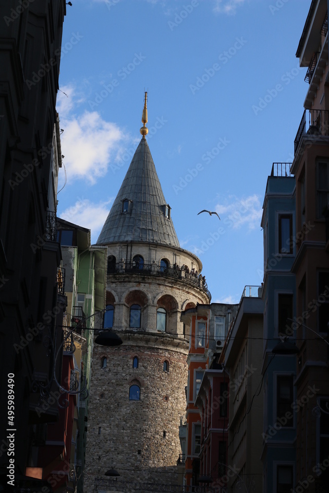 historical galata tower stretching to the blue sky	
