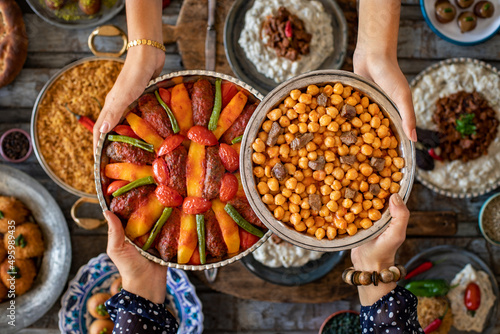 Many kinds of food at the hands of family members