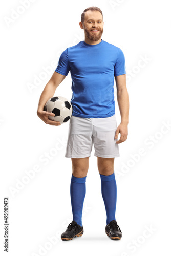 Full length portrait of a footballer holding a ball