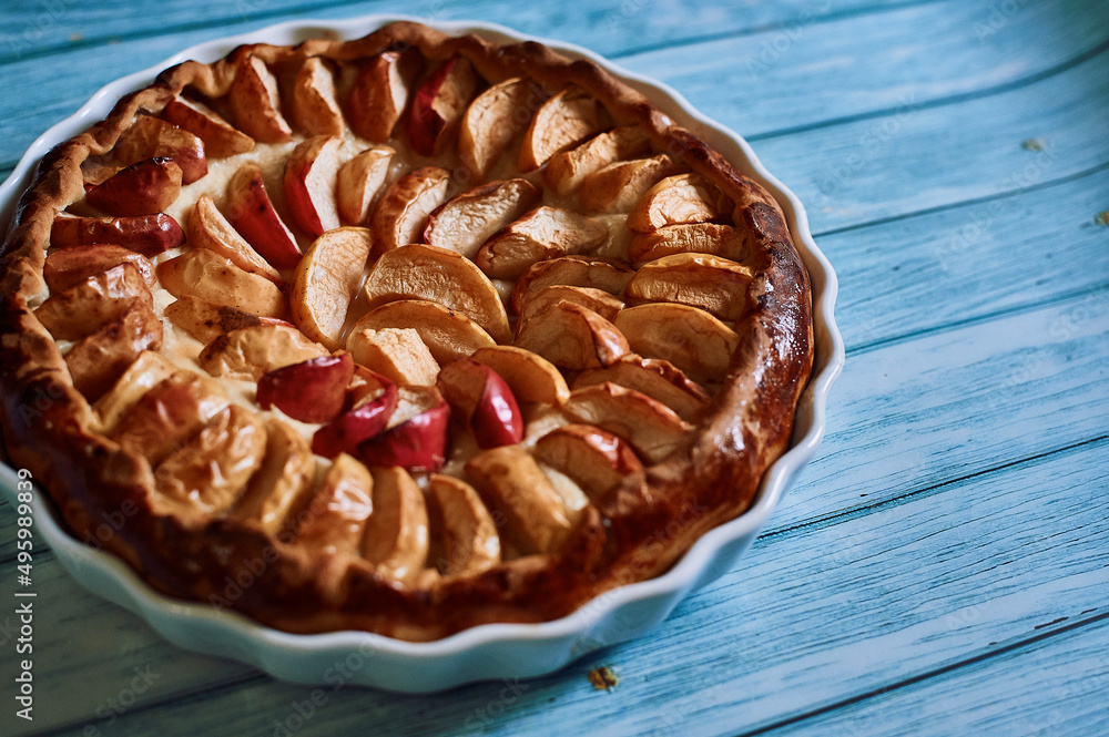 apple pie with red and yellow apples in a white plate, delicious fragrant pie cafes restaurants pastries delicious apple pie with red and yellow apples in a white plate, delicious fragrant pie cafes restaurants pastries delicious