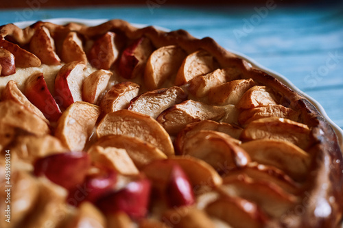 apple pie with red and yellow apples in a white plate, delicious fragrant pie cafes restaurants pastries delicious