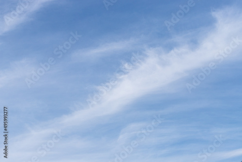 Fototapeta Naklejka Na Ścianę i Meble -  Blue Sky with White Cirrus Clouds in Diagonal Line