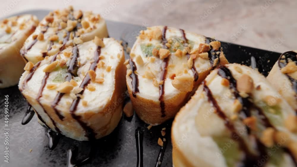 sushi. Asian cuisine. fresh, delicious, sushi beautifully served to the table. close-up. sushi of different types. food photography. beautiful sushi decoration sushi. Asian cuisine. fresh, delicious, sushi beautifully served to the table. close-up. sushi of different types. food photography. beautiful sushi decoration