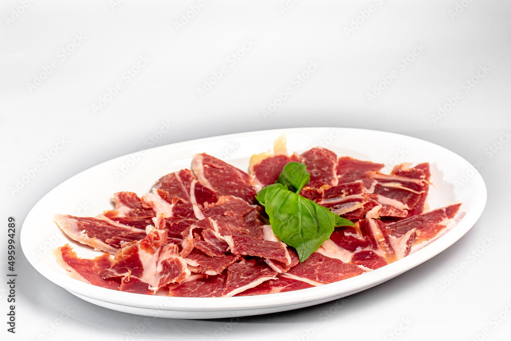 Ham sliced with parmesan, lime and arugula
