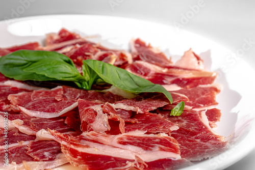 Ham sliced with parmesan, lime and arugula