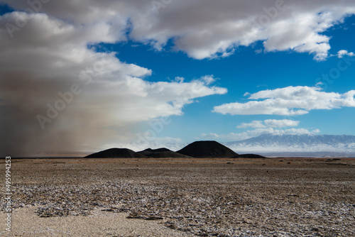 Dust storm in desolate, barren desert landscape showing the environmental damage from lithium mine operations in Nevada, USA photo