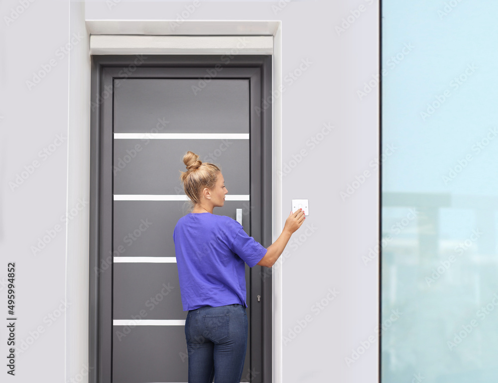 Beautiful woman opening the door of her home. Beautiful woman opening the door of her home.