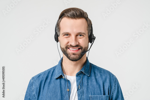 Vászonkép Closeup photo of caucasian male young hotline it support worker in headphones as