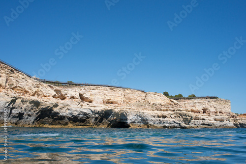 View of coast of Algarve from a boat. Summer, calm water. Portugal
