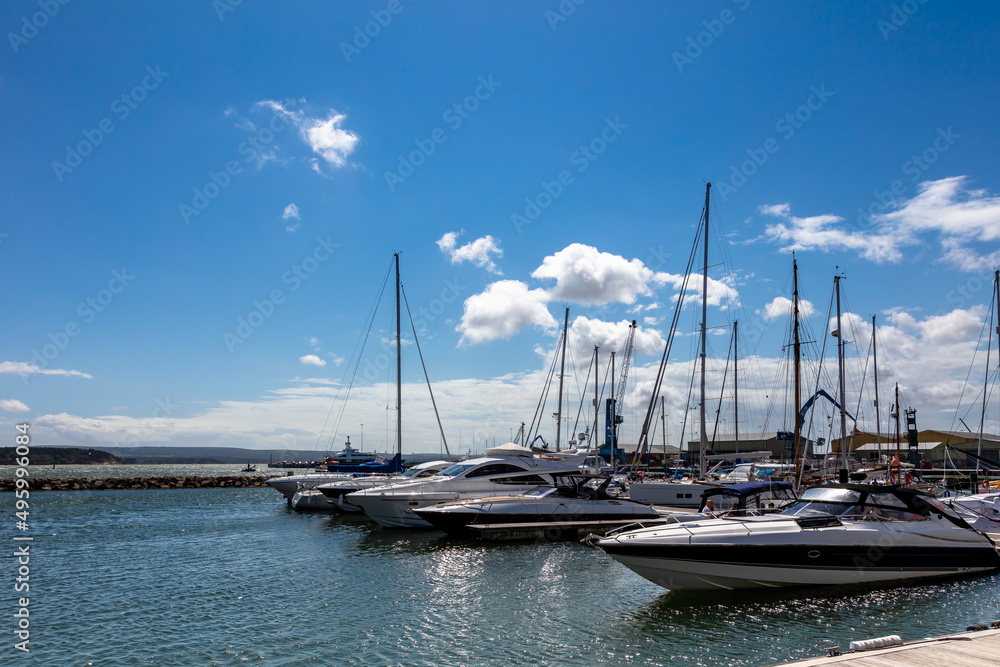 Boats moored in beautiful Poole Harbour, on a hot summer`s day