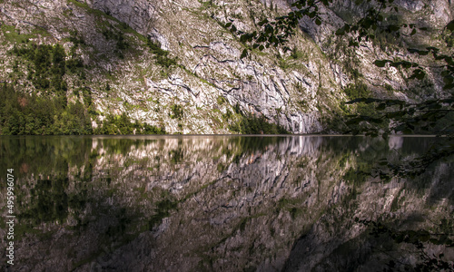  Rock wall reflected in lake