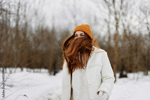 portrait of a woman red hair walk in the fresh winter air winter holidays