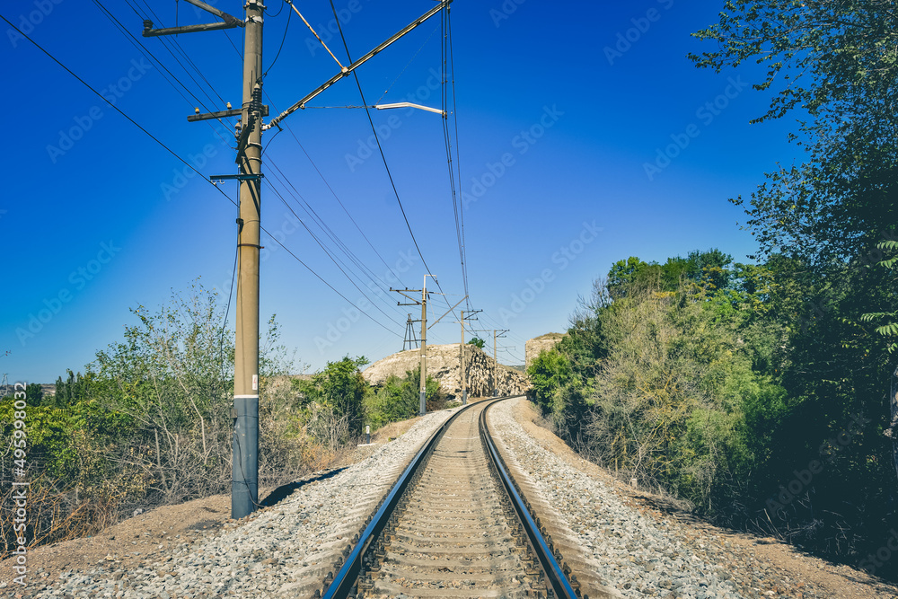Empty railway with pillars, railway in mountains Empty railway with pillars, railway in mountains