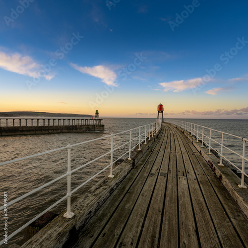 whitby pier at sunset 