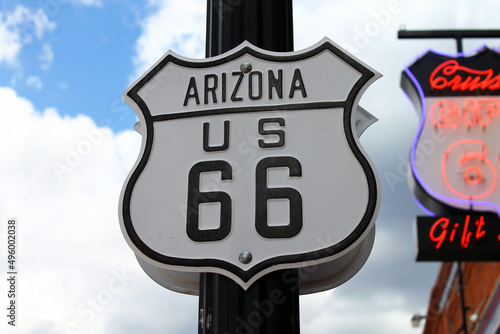 Route 66 sign in Arizona with the lights and sky on the back photo