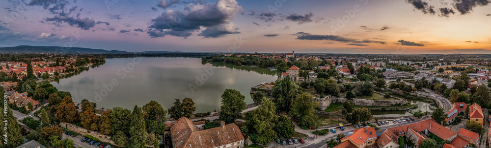 Aerial sunset view over the old lake of Tata with medieval castle surrounded by moat, bastions and walls in Hungary