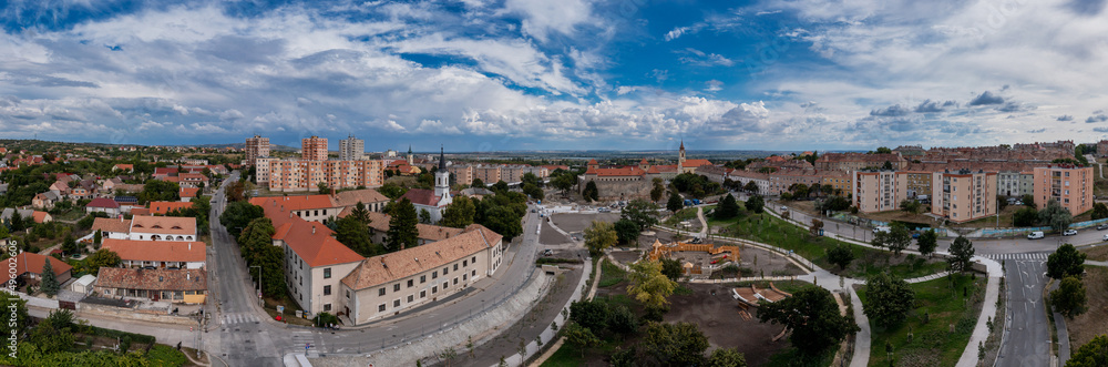 Aerial view of a communist era block house complex build for workers of the heavy industry in the mining town of Varpalota Hungary next to a medieval castle and baroque church