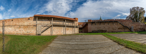 Panoramic view of medieval defenses of Szecseny Hungary with partially restored walkway and round bastion photo