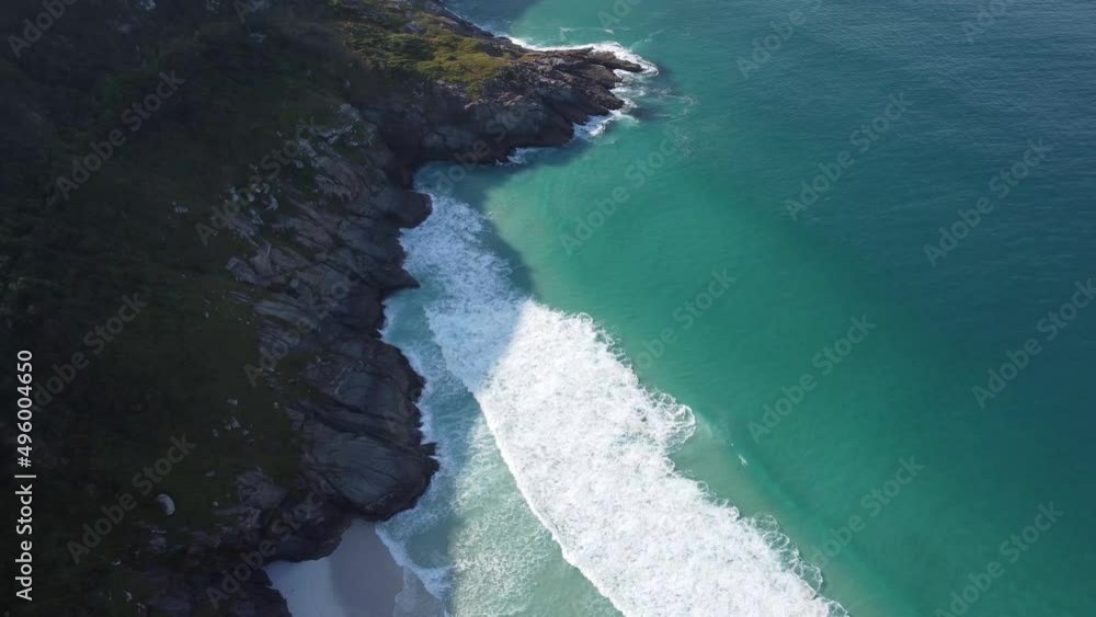 Arraial do Cabo, Rio de Janeiro, Brazil - red sunrise of wonderful paradise beach with white sands and turquoise water Arraial do Cabo, Rio de Janeiro, Brazil - red sunrise of wonderful paradise beach with white sands and turquoise water