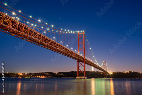 The 25 de Abril bridge at dusk in Lisbon. Portugal