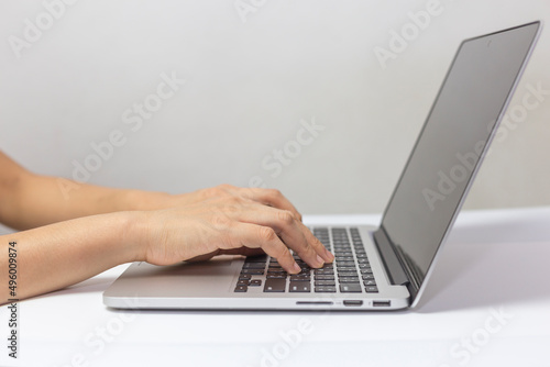 typing on laptop