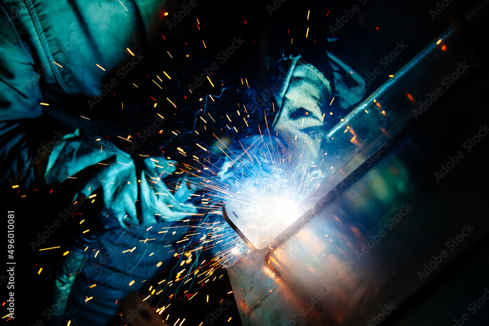 Arc welding of iron parts, close up view