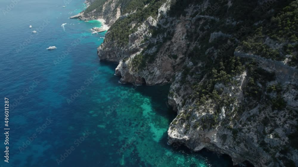 Aerial drone video of blue paradise sea cliffs in the mediterranean, Sardinia, Cala Gonone Aerial drone video of blue paradise sea cliffs in the mediterranean, Sardinia, Cala Gonone