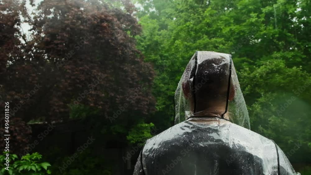 Rain.Shower.man in the rain. Slow motion. Raindrops on a raincoat . A
