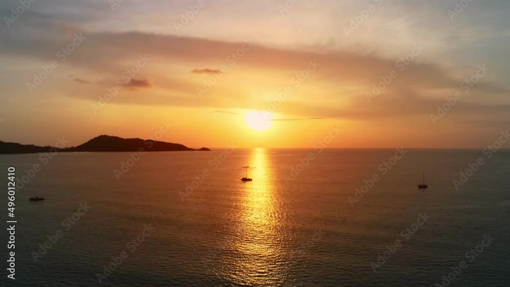 Dark sea sunset background.Tropical sea at sunset or sunrise over sea video.The sun touches horizon,Red sky in golden hour amazing seascape,Ocean beach sunsets beautiful sky Aerial view drone camera Dark sea sunset background.Tropical sea at sunset or sunrise over sea video.The sun touches horizon,Red sky in golden hour amazing seascape,Ocean beach sunsets beautiful sky Aerial view drone camera