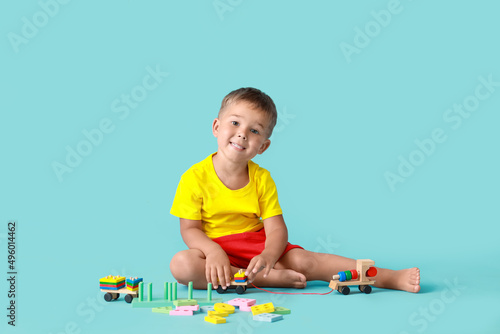 Cute little boy playing wit...