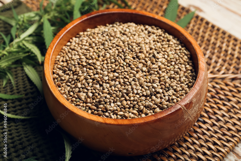 Bowl with hemp seeds on table Bowl with hemp seeds on table