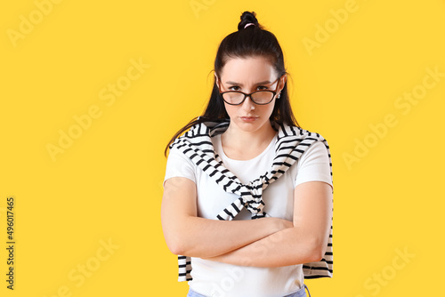 Worried young woman on yell...