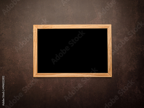Top view of empty blackboard with a wooden frame over a vintage background
