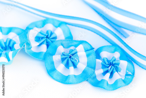 rosette, cockade, symbol, argentina, white, blue, ribbon, patriotic, flag, celebration, isolated, badge, argentine, american, election, ornament, national, country, anniversary, festival, circular,  photo