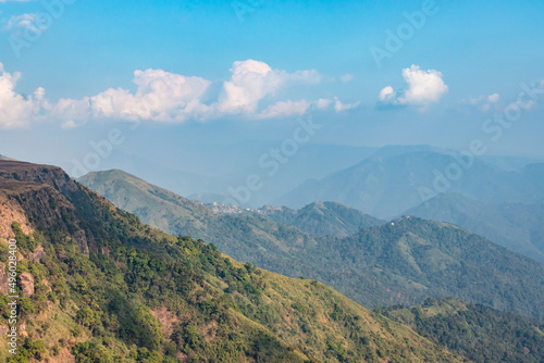 mountain layers covered with white mists and forests at morning