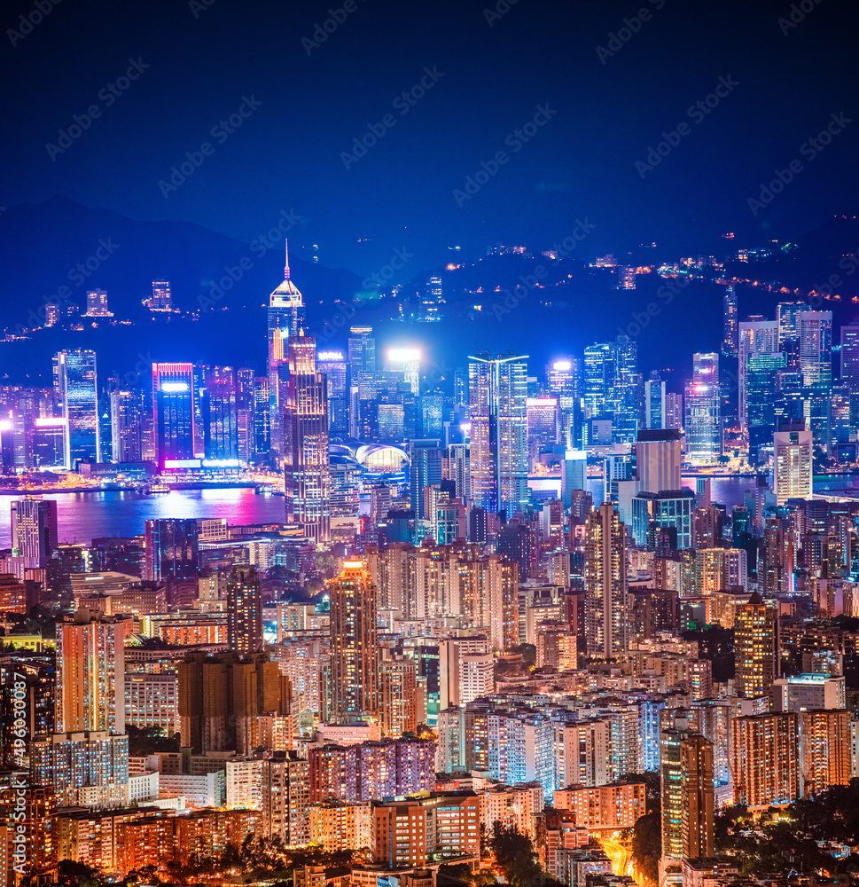 Fototapeta premium epic view of Hong Kong Night, from Kowloon to Hong Kong Island. metropolis in Asia, aerial, amazing colorful cityscape