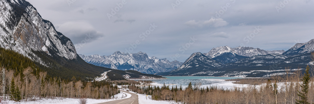 Panoramic landscape in winter season taken from Alberta, Canada. Stunning mountains and lake views. 