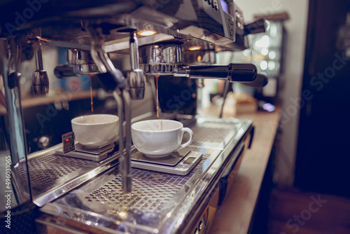 Canvastavla Modern coffee machine brewing espresso in cafeteria